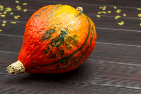 Bright orange pumpkins on table. Dark wooden background. Top viewの写真素材