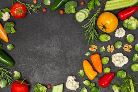 Multicolored vegetables on table. Black background. Flat lay.の写真素材