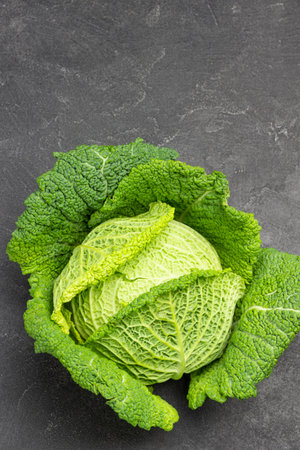 Savoy cabbage on black background. copyspace. flat lay.の写真素材