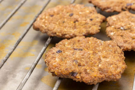 Grilled burger on the grill. top view. close up. Rusty backgroundの写真素材