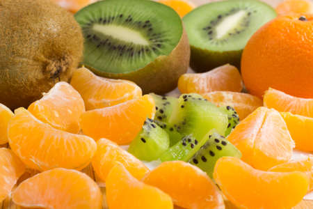 Fruits on the table. Tangerines and kiwiの写真素材