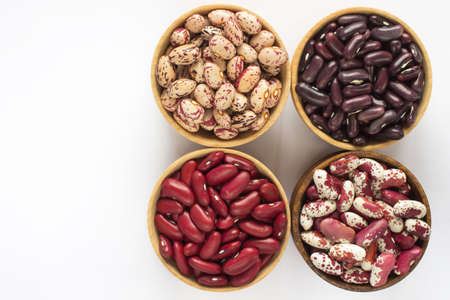 Four kinds of beans on white background. top viewの写真素材