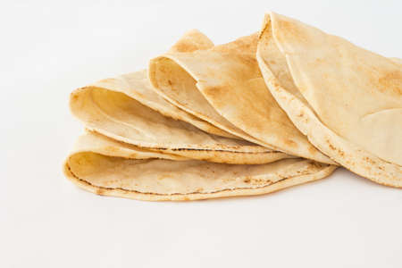 Tortilla, cakes made of wheat flour on a white backgroundの写真素材