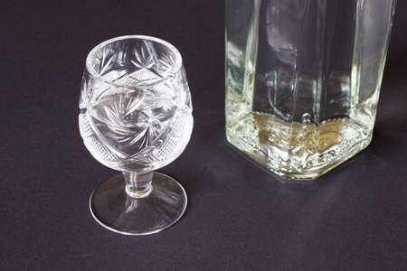 Crystal glass and the bottle on a dark backgroundの写真素材