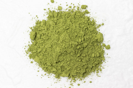 Matcha green powder for making matcha green tea. flat lay. white backgroundの写真素材