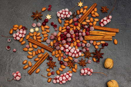 Frozen berries, spices and nuts on a black background. flat lay.の写真素材