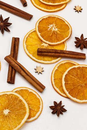 Orange chips, cinnamon sticks and star anise. flat lay. white background.の写真素材