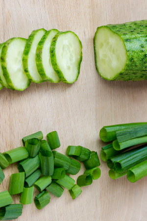 Sliced green vegetables on a cutting board. top viewの写真素材