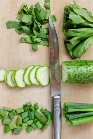 Sliced green vegetables on a cutting board. top viewの写真素材