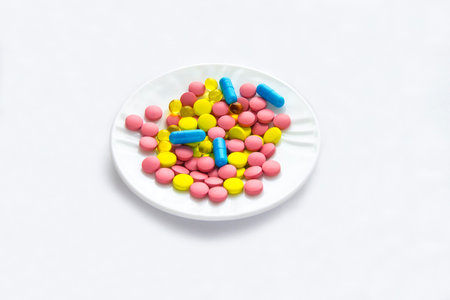colored pills for treatment on a tableの写真素材