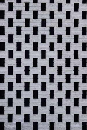 Part of a white brick wall. Background.