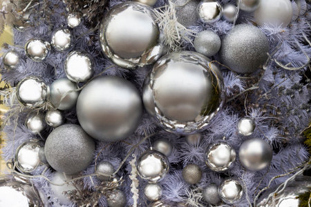 New Year composition with silver balls and silver fir tree branches. Part of the frame.の写真素材