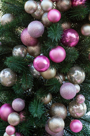 Pink and silver balls on the Christmas tree. Part of the frameの写真素材