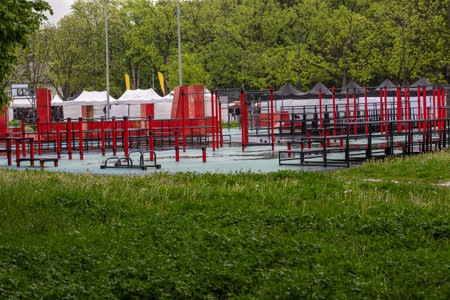 Sports ground with outdoor exercise equipment. Green trees aroundの写真素材