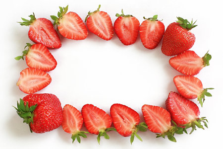 frame of appetizing strawberries on a white background.の写真素材
