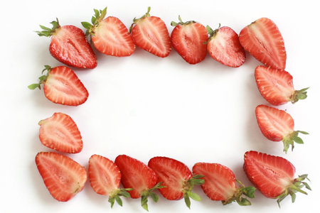 frame of appetizing strawberries on a white background.の写真素材