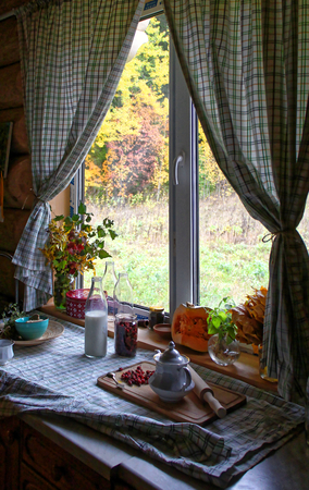 Wooden house window view with curtainsの写真素材