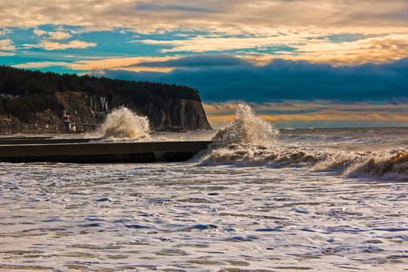 Stormy waves on the shore with vivid blue skyの写真素材