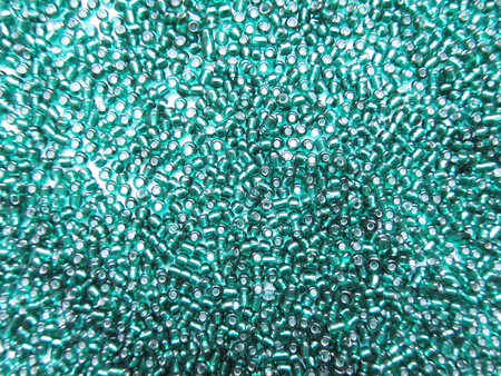 It is a lot of green beadsの写真素材