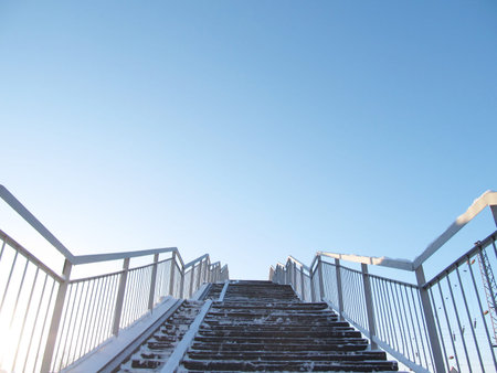 Steps rise to the sky, a blue winter background upの写真素材