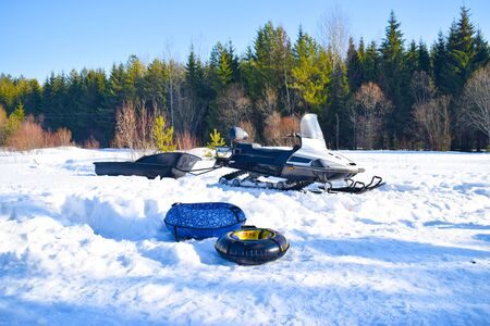 Winter landscape in Russia. Winter recreation, tubing and Snowmobilingの写真素材
