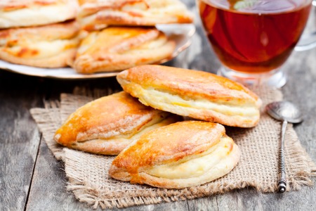 Homemade  cottage cheese pies with a cup ofteaの写真素材