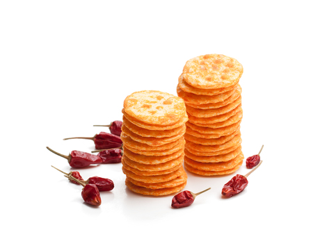 Round  shape rice cracker with chili pepper isolated on white の写真素材