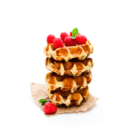 Continental  classics belgian butter waffles with raspberries isolated on white の写真素材