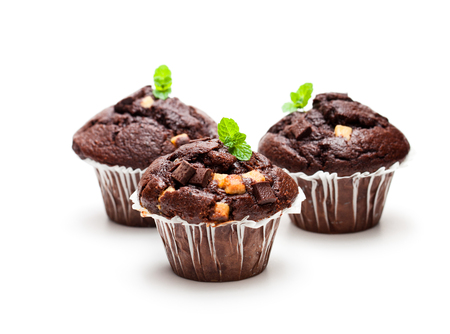 Triple  chocolate muffins isolated on white の写真素材