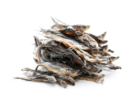 Heap  of dried fishes isolated on whiteの写真素材
