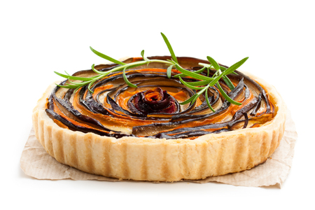 Homemade  vegetarian pie with colored vegetables isolated on whiteの写真素材