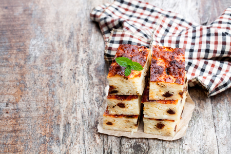 Homemade  cottage cheese casserole slices on wooden tableの写真素材