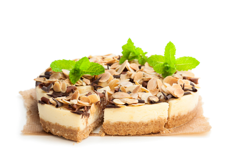 Almond  cheesecake with chocolate flakes isolated on whiteの写真素材