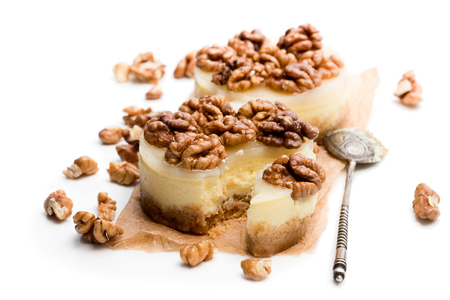 Two mini  walnut cheesecake isolated on whiteの写真素材