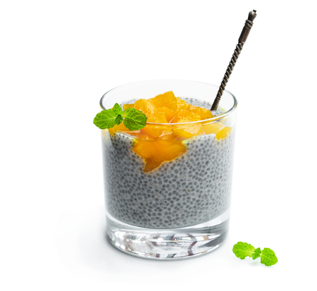 Chia  seed pudding with yellow jam isolated on whiteの写真素材