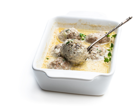 Meat  balls in cream sauce isolated on whiteの写真素材