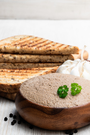 Fresh  pate with toasted bread on white tableの写真素材