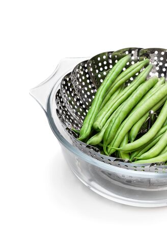 Fresh  raw beans in steam basket. Ready for cooking.の写真素材