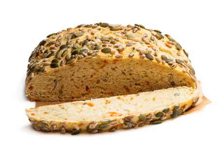 Seed  covered carrot bread bloomer loaf isolated on a whiteの写真素材