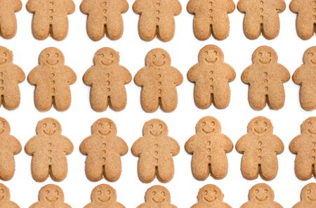 Seamless  Endless pattern of baked gingerbread man cookies isolated on whiteの写真素材