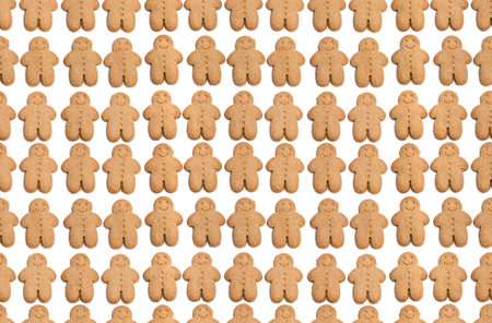 Seamless  Endless pattern of baked gingerbread man cookies isolated on white