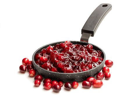 Fresh  homemade cranberry sauce in small pan isolated on white の写真素材
