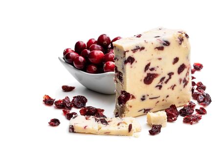 Cranberry  cheddar cheese with wheat crackers isolated on whiteの写真素材