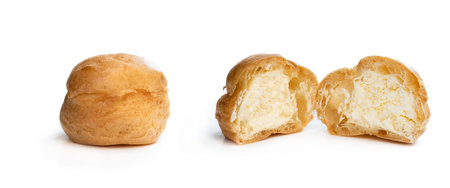 Homemade  profiteroles stuffed with whipping cream isolated on white 
