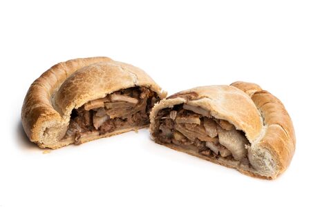 Homemade  cornish pasty with diced beef and potatoes with swede isolated on white の写真素材