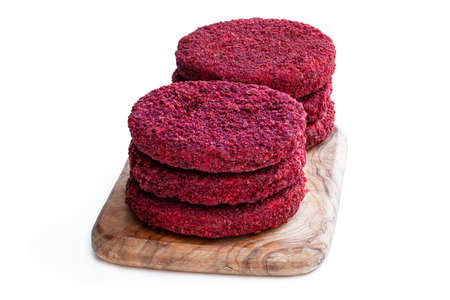 Vegan beetroot burgers on wooden board isolated on whiteの写真素材
