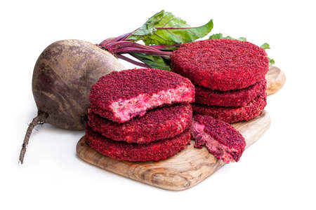 Vegan beetroot and bean burgers on wooden board isolated on whiteの写真素材