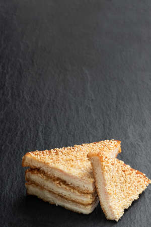Sesame  seeded prawn toasts on black stone backgroundの写真素材