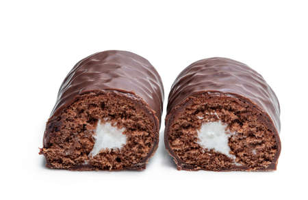 Chocolate  sponge cake cream filling covered with milk chocolate isolated on whiteの写真素材