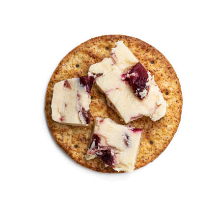 Cranberry cheddar cheese with wheat crackers isolated on white. Top view.の写真素材